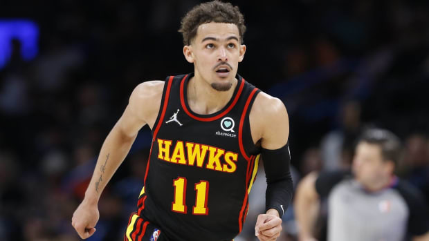 Trae Young runs up the court for the Atlanta Hawks.