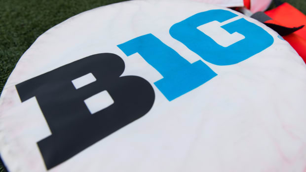 Big Ten logo on yardage markers.
