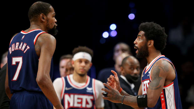 Apr 25, 2022; Brooklyn, New York, USA; Brooklyn Nets guard Kyrie Irving (11) talks to forward Kevin Durant (7) during the fourth quarter of game four of the first round of the 2022 NBA playoffs against the Boston Celtics at Barclays Center. The Celtics defeated the Nets 116-112 to win the best of seven series 4-0.