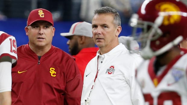 Clay Helton and Urban Meyer during a USC vs. Ohio State game.