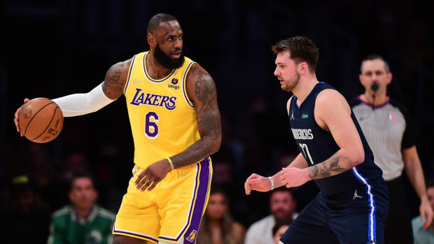 LeBron James backs down Luka Dončić during a Lakers–Mavericks game.