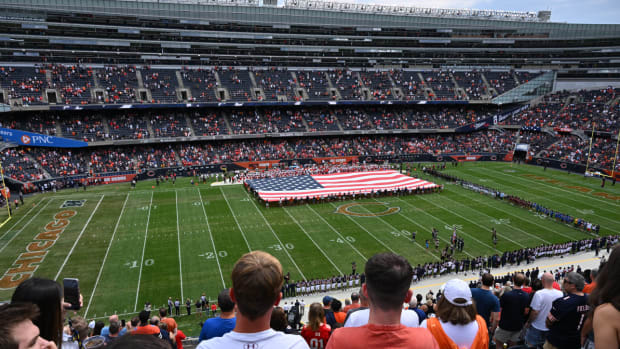 Aug 13, 2022; Chicago, Illinois, USA; A large American Flag is unfurled on the field for the U.S. National Anthem before a pre-season game between the Chicago Bears and the Kansas City Chiefs at Soldier Field. Mandatory Credit: Jamie Sabau-USA TODAY Sports
