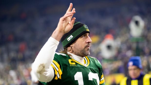 Aaron Rodgers gestures to crowd after a Packers game.