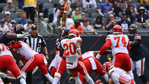 Aug 13, 2022; Chicago, Illinois, USA; Kansas City Chiefs safety Justin Reid (20) kicks the extra point after a Chiefs touchdown in the second quarter against the Chicago Bears at Soldier Field.