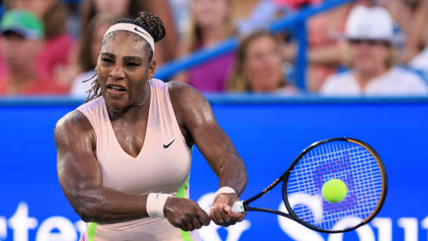 Serena Williams, of the United States, hits a backhand to Emma Raducanu, of Britain, during the Western & Southern Open tennis tournament Tuesday, Aug. 16, 2022.