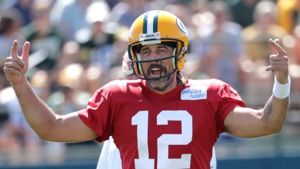 Green Bay Packers quarterback Aaron Rodgers (12) reacts during training camp.
