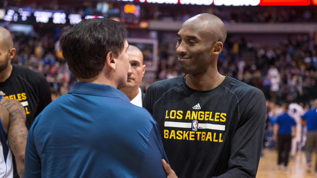 Lakers guard Kobe Bryant (24) greets Mavericks owner Mark Cuban after game at the American Airlines Center.